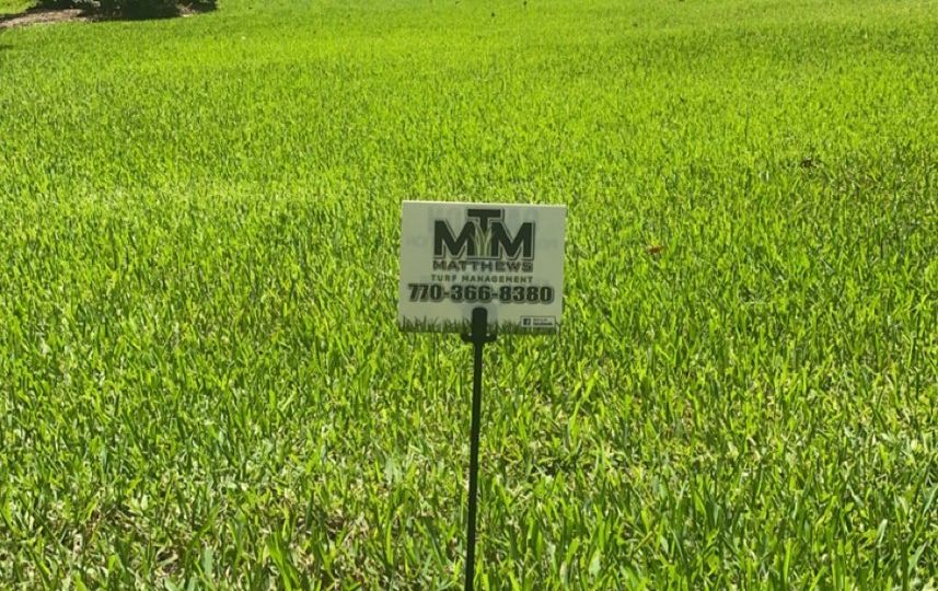 Lawn care service marker in client front yard Matthews Turf Management Augusta GA